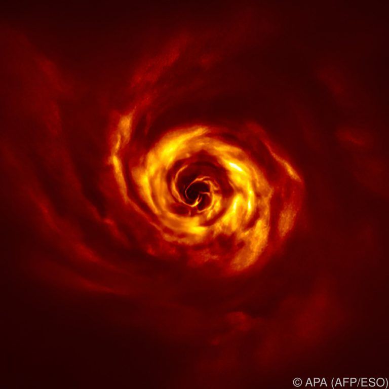 Die Bilder zeigen eine Spirale aus Gas und Staub um den Stern AB Aurigae.AFP