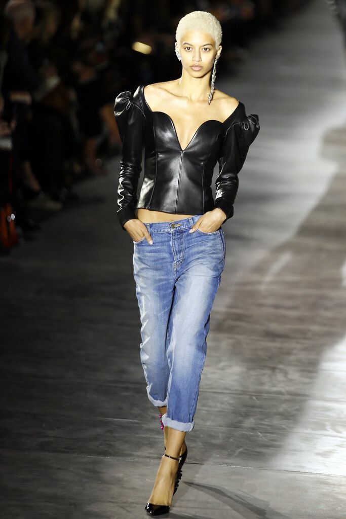 A model wears a creation by Yves Saint Laurent during their Spring-Summer 2017 Ready-to-Wear fashion show, in Paris, Tuesday, Sept. 27, 2016. All eyes are on Anthony Vaccarello who launches his debut as designer for storied French house Saint Laurent as creative upheavals continue to impact Paris Fashion Week. (AP Photo/Francois Mori)