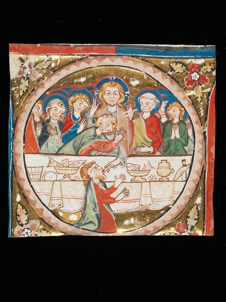 Über 700 Jahre alt ist diese kleine Malerei, die ursprünglich zusammen mit anderen Fragmenten den Buchstaben „I“ ergab auf der Seite 87 eines prachtvollen Choralbuchs. Geschrieben wurde es um 1312 im damaligen Dominikanerinnenkloster St. Katharinental in Diessenhofen im Kanton Thurgau. Im 19. Jahrhundert wurde das Blatt aus dem Graduale gerissen und die Medaillons wurden einzeln verkauft. Sieben dieser Buchmalereien existieren bis heute. Sie werden in Nürnberg, Zürich und Frankfurt verwahrt. Das Bild des letzten Abendmahls gehört der Schweizerischen Eidgenossenschaft, der Gottfried Keller-Stiftung und dem Kanton Thurgau.
              St. Galler Stiftsbibliothek; Karfut; Jens Piske