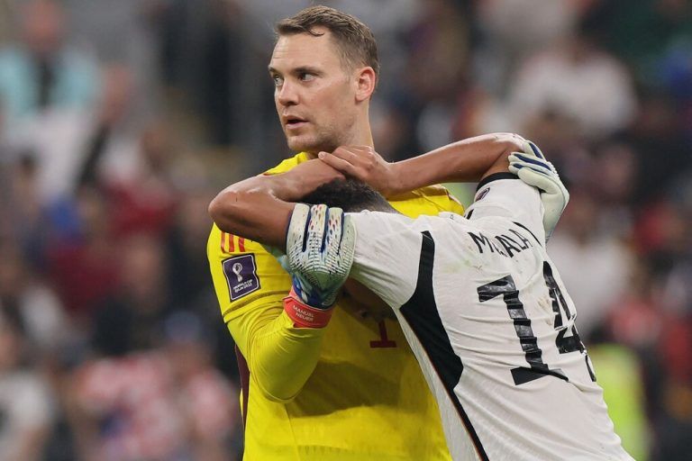 Germany's midfielder #14 Jamal Musiala (R) and Germany's goalkeeper #01 Manuel Neuer react during the Qatar 2022 World Cup Group E football match between Costa Rica and Germany at the Al-Bayt Stadium in Al Khor, north of Doha on December 1, 2022. (Photo by KARIM JAAFAR / AFP)